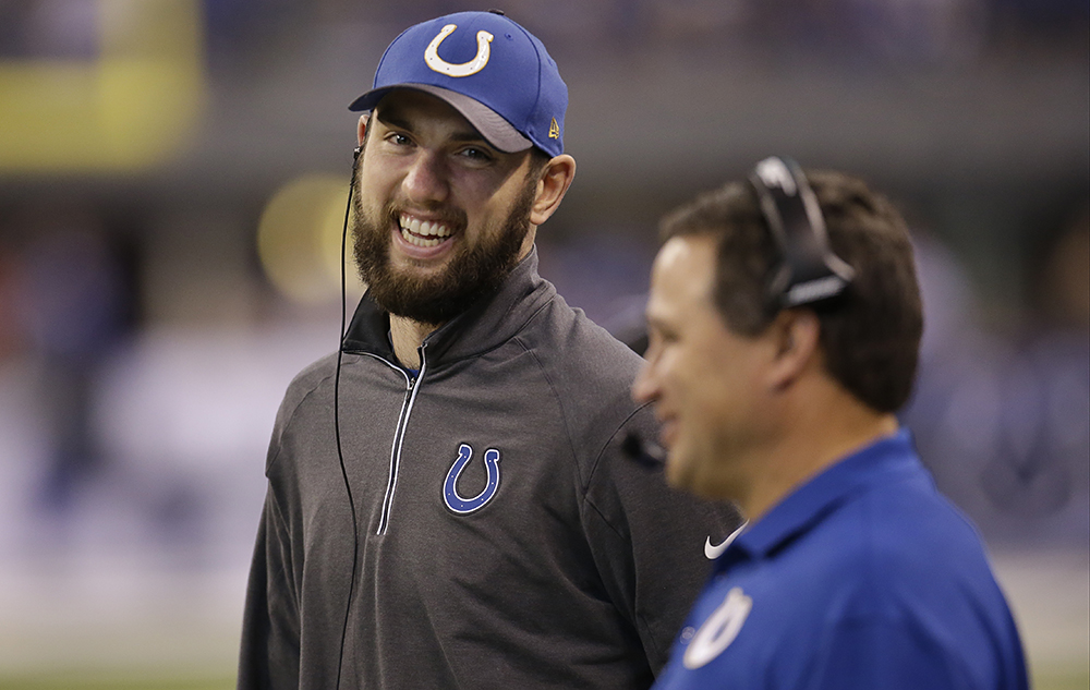 Indianapolis Colts Andrew Luck watches from the sideline during the first half of an NFL football game against the Houston Texans Sunday Dec. 20 2015 in Indianapolis