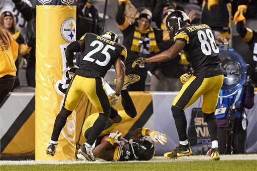 Pittsburgh Steelers wide receiver Antonio Brown celebrates with teammates Darrius Heyward Bey, and Brandon Boykin after scoring a touchdown during the second half of an NFL football game against the Indianapolis Colts Sunday Dec. 6 2015