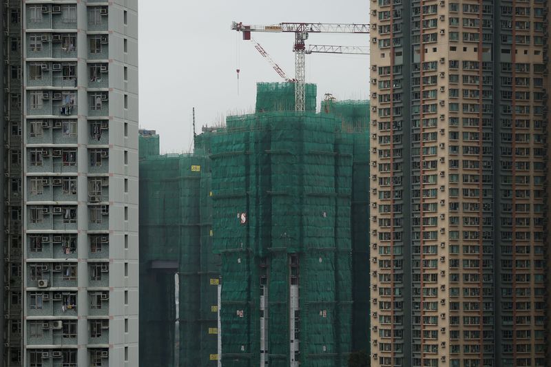 Construction cranes are seen at the building site of a new private housing complex in Hong Kong China