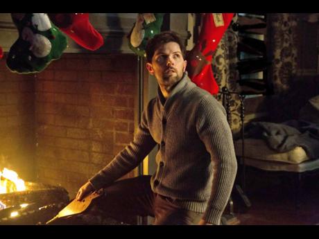 Contributed     Adam Scott gets a lesson in Christmas Spirit in ‘Krampus