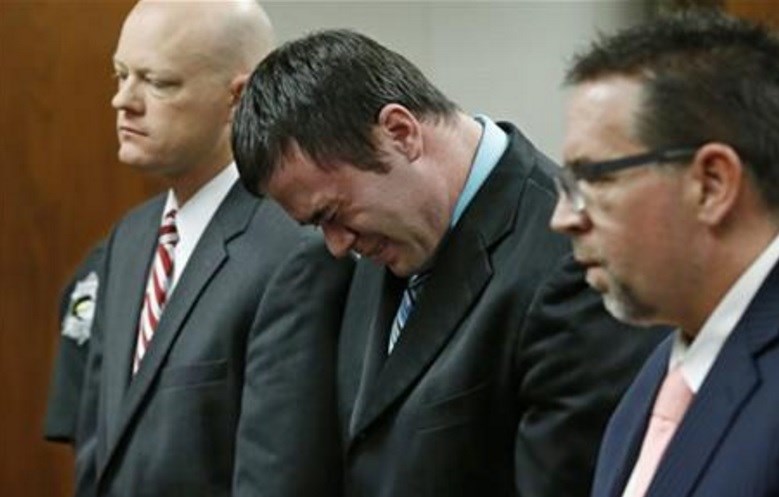 Daniel Holtzclaw center cries as he stands in front of the judge after the verdicts were read in his trial in Oklahoma City Thursday Dec. 10 2015