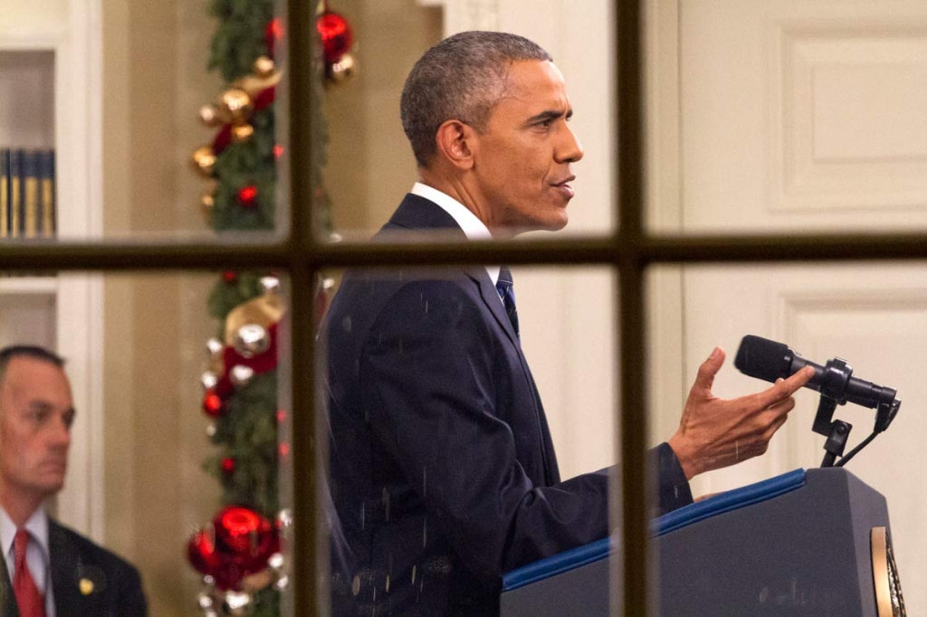 President Barack Obama addresses the nation from the Oval Office at the White House in Washington Sunday night Dec. 6 2016