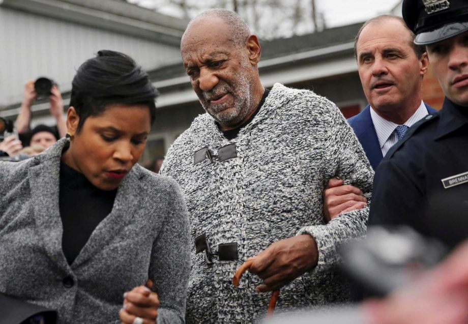 Actor and comedian Bill Cosby is helped as he leaves a court appearance where he faced a felony charge of aggravated indecent assault Wednesday Dec. 30 2015 in Elkins Park Pa. Cosby was arrested and charged Wednesday with drugging and sexually assault