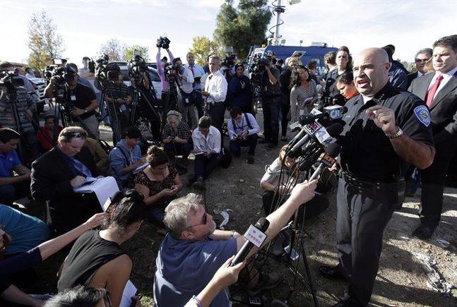 San Bernardino Police Chief Jarrod Burguan right talks to the media near the the site of a mass shooting on Wednesday Dec. 2 2015 in San Bernardino Calif. One or more gunmen opened fire Wednesday at a Southern California social services center shoo