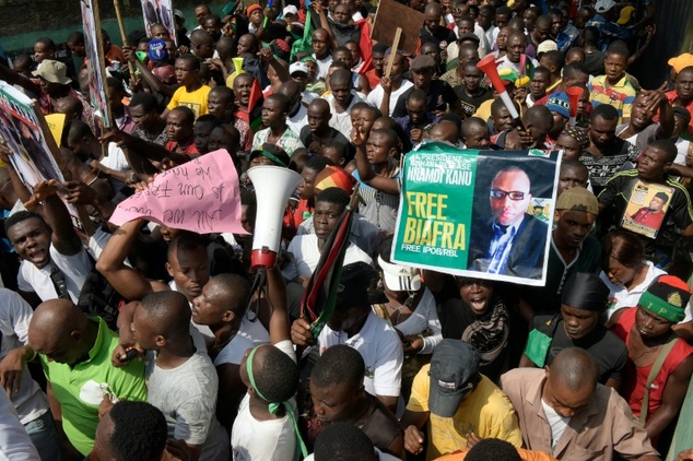 Pro-Biafra supporters hold a poster of jailed activist Nnamdi Kanu during a protest in Aba southeastern Nigeria