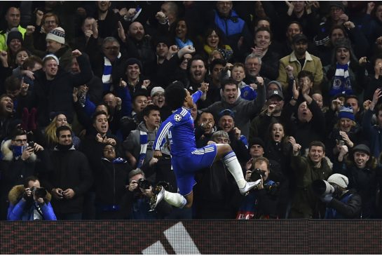 Chelsea's Brazilian midfielder Willian celebrates the team's second goal as the Blues advanced to the Champions League round of 16 with a 2-0 win over Porto