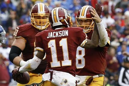 Washington Redskins wide receiver De Sean Jackson celebrates his touchdown with quarterback Kirk Cousins during the first half of an NFL football game against the New York Giants in Landover Md. Sunday Nov. 29 2015