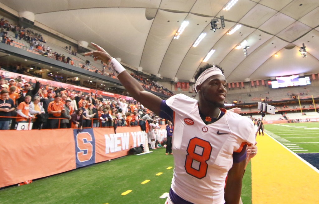 Credit Ken Ruinard           Clemson wide receiver Deon Cain celebrates with fans after a 37-27 win against Syracuse