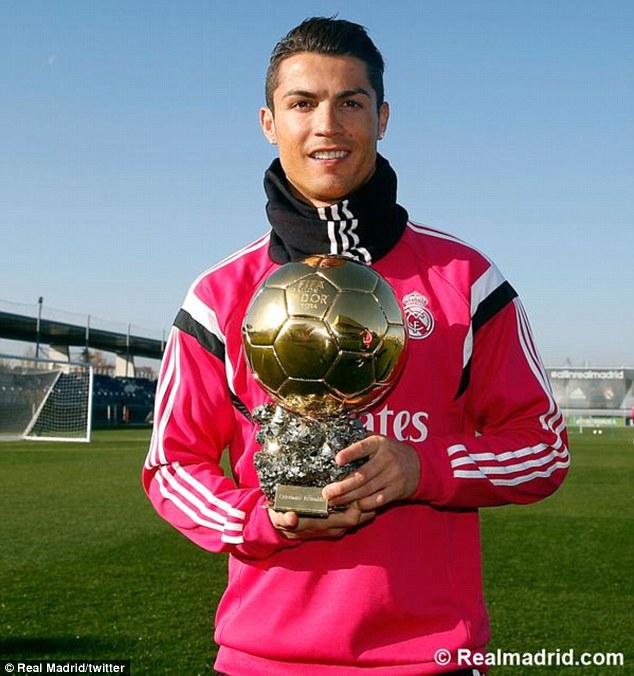 Cristiano Ronaldo celebrates his Ballon D'Or win in training