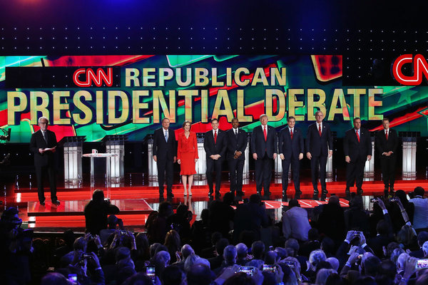 CNN anchor Wolf Blitzer looks on as Republican presidential candidates John Kasich Carly Fiorina Marco Rubio Ben Carson Donald Trump Ted Cruz Jeb Bush Chris Christie and Rand Paul are introduced during the CNN presidential debate at The Venetian La