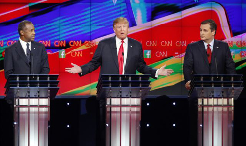 Donald Trump speaks as Ben Carson and Ted Cruz look on during the CNN Republican presidential debate at the Venetian Hotel and Casino in Las Vegas on Dec. 15 2015. /AP