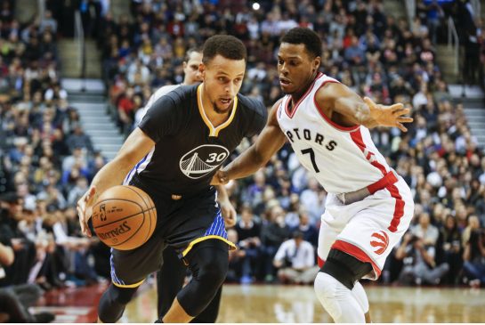 Warriors guard Stephen Curry left won the battle of the guards Saturday scoring 44 points to Kyle Lowry's 41