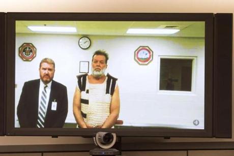 Robert L. Dear Jr. who appeared via video link is accused of fatally shooting three people