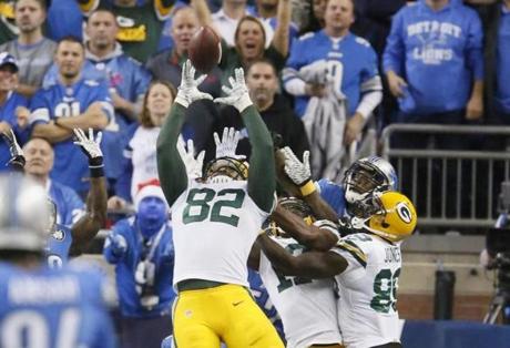 Packers tight end Richard Rodgers reaches to catch the winning pass on the last play against the Lions