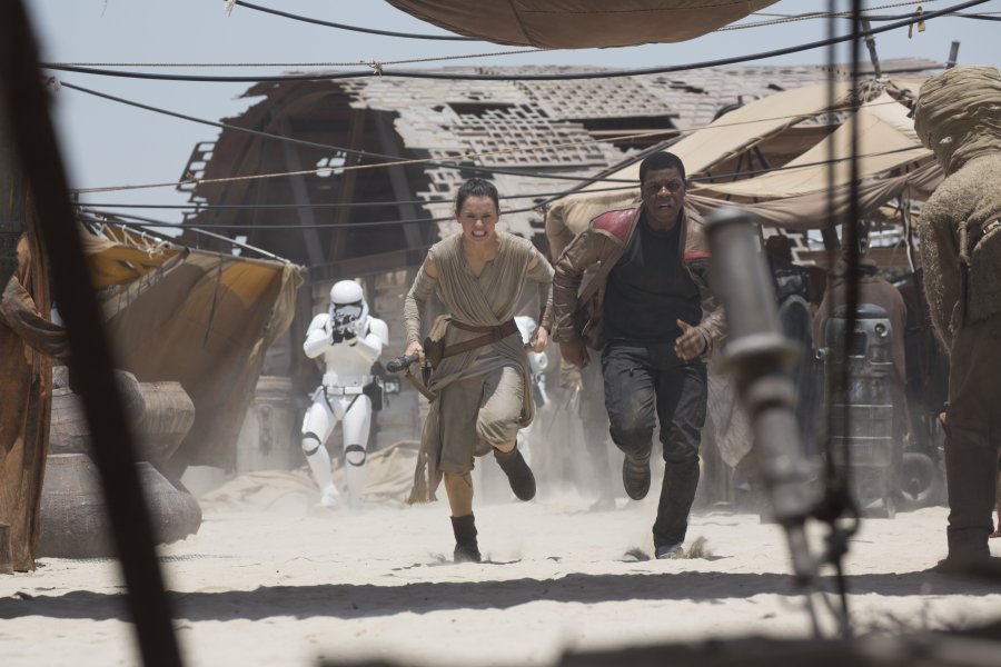 Daisy Ridley left and John Boyega hit the ground running in “Star Wars The Force Awakens.”