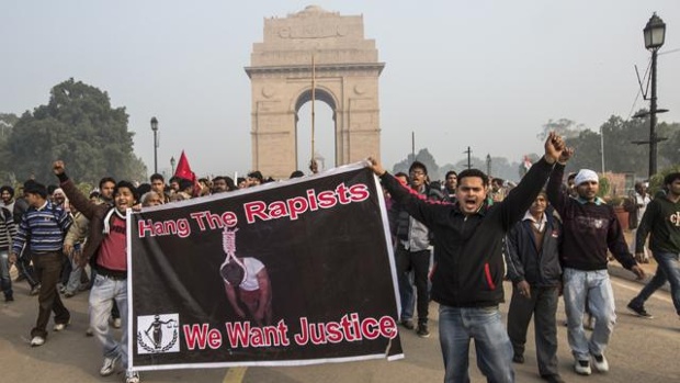 Demonstrators chant slogans during a protest against the Indian government's reaction to recent rape incidents in India in front of India Gate on Dec. 23 2012 in New Delhi India