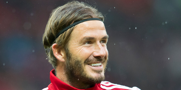 Great Britain and Ireland's David Beckham smiles before the Unicef Match for Children charity soccer match between a Great Britain and Ireland team