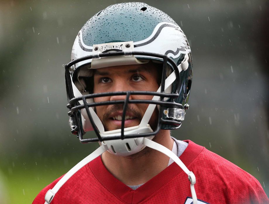 Philadelphia Eagles quarterback Sam Bradford walks to the practice bubble in the rain before NFL football practice at the Nova Care Complex in Philadelphia Pa. Tuesday Dec. 1 2015