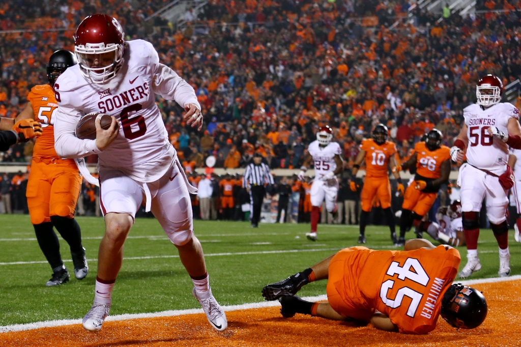 Oklahoma quarterback Baker Mayfield scores during the third quarter of a 58-23 win over Oklahoma State on Nov. 28. Mayfield has accounted for XX touchdowns this season