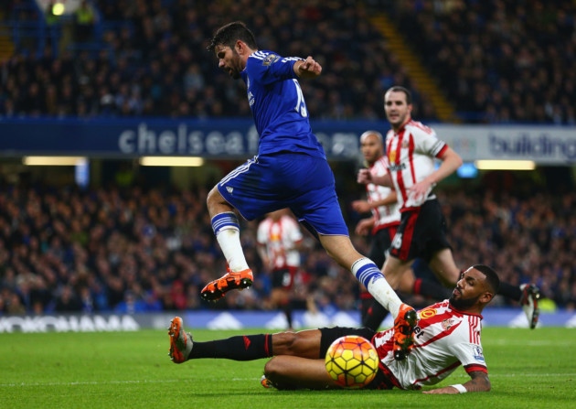 Diego Costa of Chelsea is tackled by Yann M