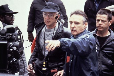 Director Dennis Hopper second from right with cinematographer Haskel Wexler third from right during the making of the movie “Colors” in 1988