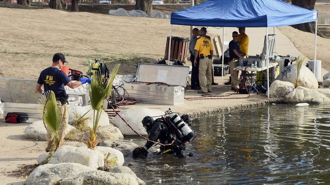 Divers were looking for electronic devices a hard drive and other items linked to the shooters