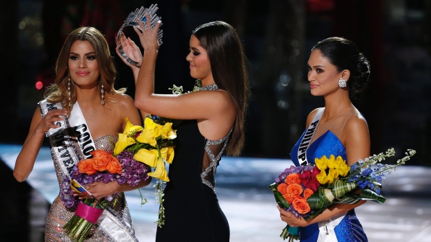 Former Miss Universe Paulina Vega centre removes the crown from Miss Colombia Ariadna Gutierrez left before giving it to Miss Philippines Pia Alonzo Wurtzbach right at the Miss Universe pageant on Sunday in Las Vegas