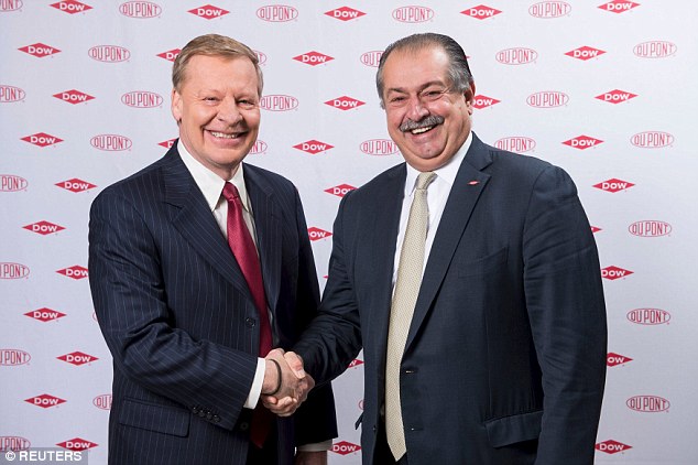 DowDuPont Edward D. Breen, chairman and CEO of Du Pont shakes hands with Andrew N. Liveris, Dow Chemical's chairman and CEO