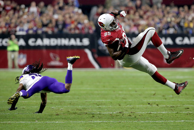 Arizona Cardinals tight end Darren Fells is up-ended by Minnesota Vikings cornerback Trae Waynes during the second half of an NFL football game Th