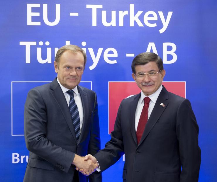 Turkish Prime Minister Ahmet Davutoglu is welcomed by European Council President Donald Tusk