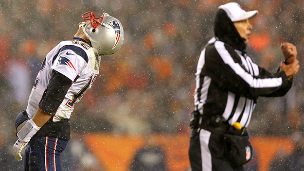 DENVER CO- NOVEMBER 29 Quarterback Tom Brady #12 of the New England Patriots reacts to a holding call by the referee in the fourth quarter at Sports Authority Field at Mile High