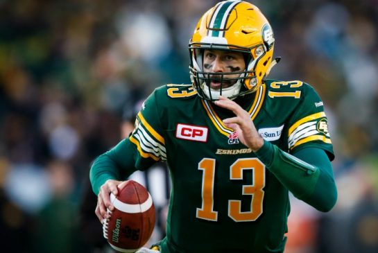 Edmonton Eskimos quarterback Mike Reilly runs with the ball during first half CFL West Division final football action against the Calgary Stampeders