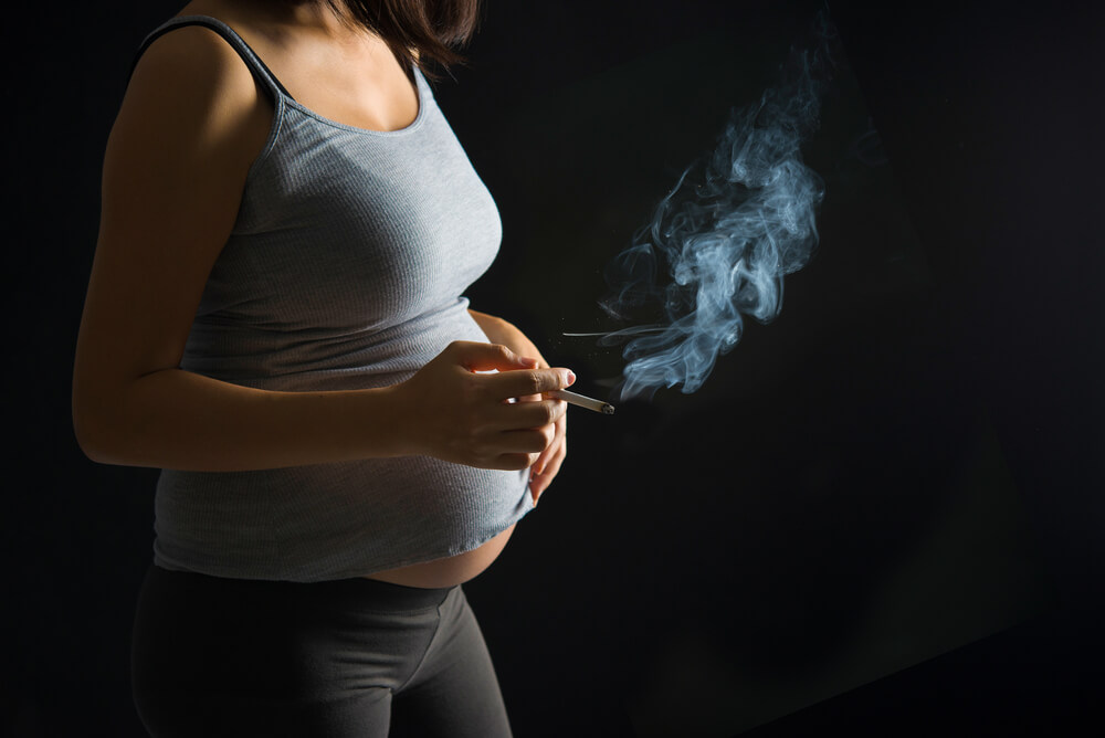 'passive smoking causes infertility