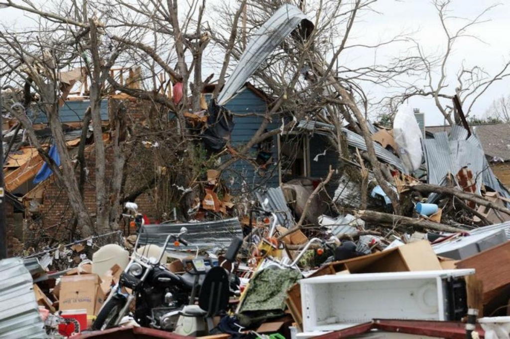 A pile of debris is all that is left of what used to be a apartment unit at the Landmark at the Lake Village West apartment complex after a tornado in Garland Texas