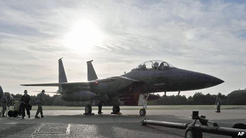 FILE- An F-15E Strike Eagle sits on the flightline at Royal Air Force Lakenheath England in October 2010