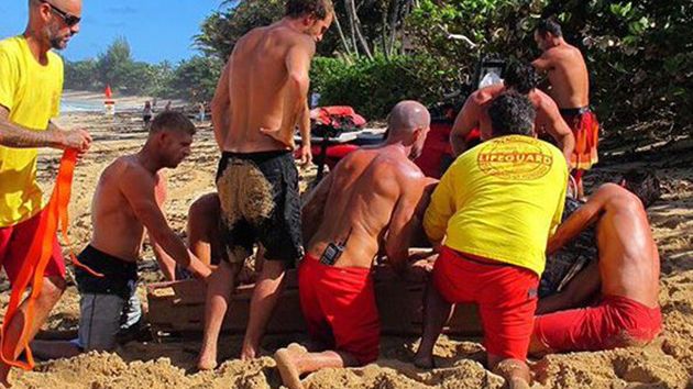 Fanning helps lifeguards with Geiselman. Image Twitter