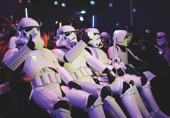 Fans dressed as Star Wars character Stormtroopers gesture as they arrive for the premiere of “Star Wars The Force Awakens” in Shanghai