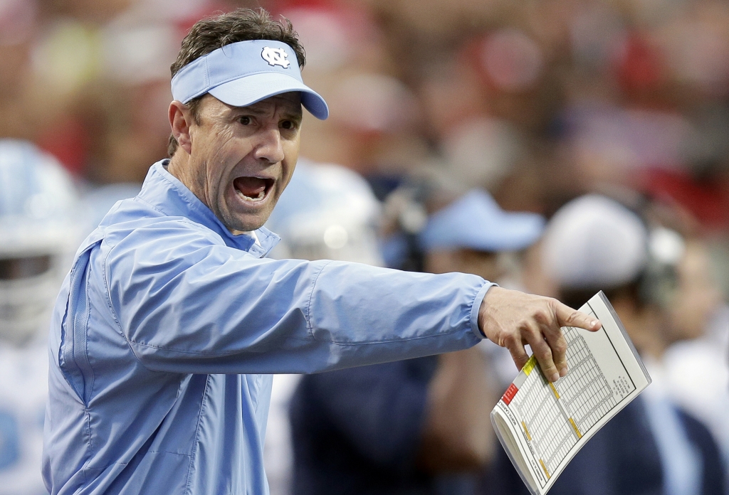 North Carolina coach Larry Fedora yells at an official during the first half an NCAA college football game against North Carolina State in Raleigh N.C. Fedora is in his fourth season and has guided the No. 8 Tar