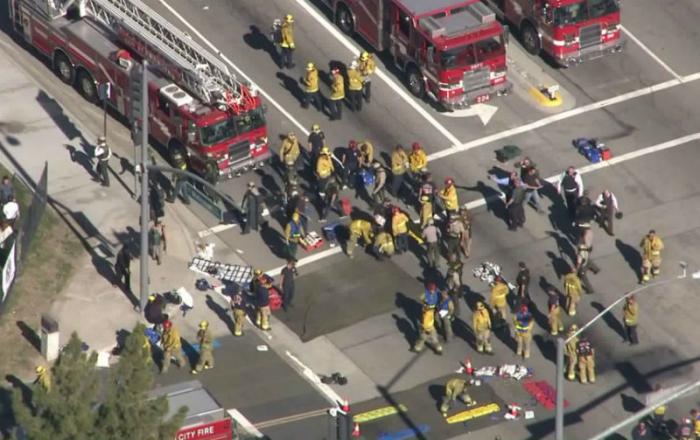 First responders set to work helping injured civilians following a mass shooting in San Bernardino California