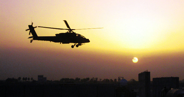 An AH-64D Apache helicopter belonging to 1st Battalion 4th Aviation Regiment Attack Reconnaissance Battalion flies over Iraq