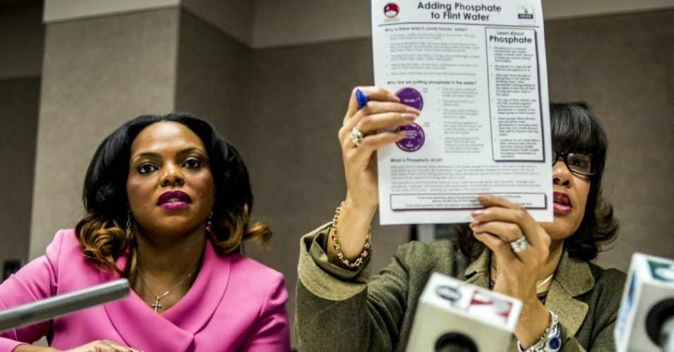 Flint Mayor Karen Weaver right and City Administrator Natasha Henderson address questions about adding supplemental phosphates to the city’s water during a news conference in December