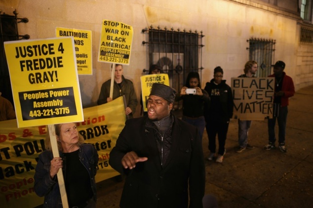 The Rev. Cortly Witherspoon and members of the Peoples Power Assembly protest outside the Baltimore City Circut Courthouse East during the trial of polic