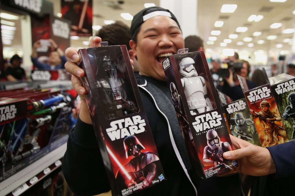 A shopper displays Star Wars movie franchise merchandise at a Target Australia Pty department store in the suburb of Parramatta in western Sydney Australia