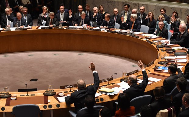 Foreign Ministers vote during a UN Security Council meeting on Syria