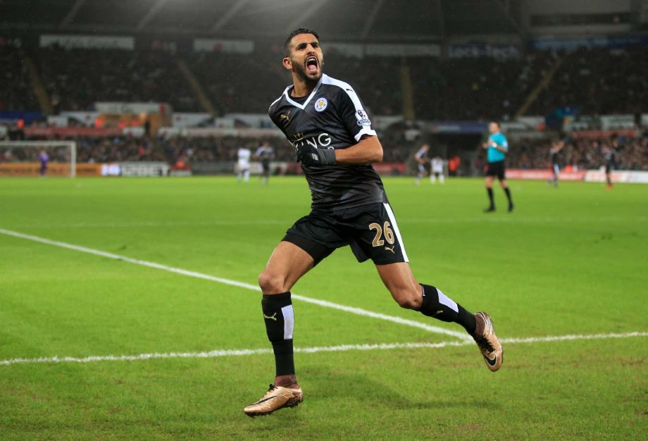 Leicester City's Riyad Mahrez celebrates scoring his side's third goal of the game during their English Premier League soccer match against Swansea City at the Liberty Stadium Swansea Wales Saturday Dec.5 2015.  UNITED KINGDOM