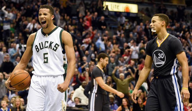 Dec 12 2015 Milwaukee WI USA Milwaukee Bucks guard Michael Carter Williams reacts in front of Golden State Warriors guard Stephen Curry after a Bucks basket late in the fourth quarter at BMO Harris Bradley Center. The Bucks beat the Warrior