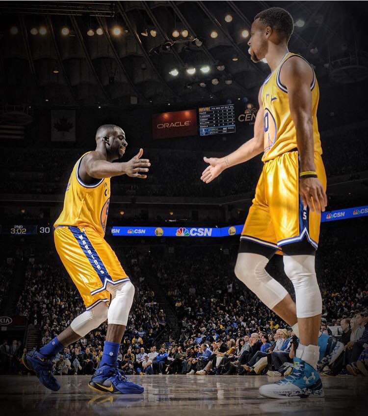 From left Draymond Green and Stephen Curry excited after a victory on their home floor