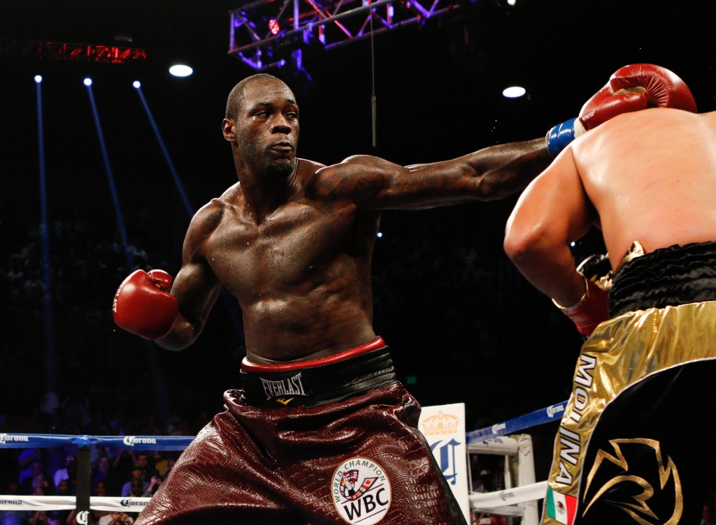 Jun 13 2015 Birmingham AL USA Deontay Wilder hits Eric Molina during the WBC Championship at Bartow Arena. Mandatory Credit Marvin Gentry-USA TODAY Sports