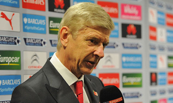 Arsene Wenger addresses a TV camera