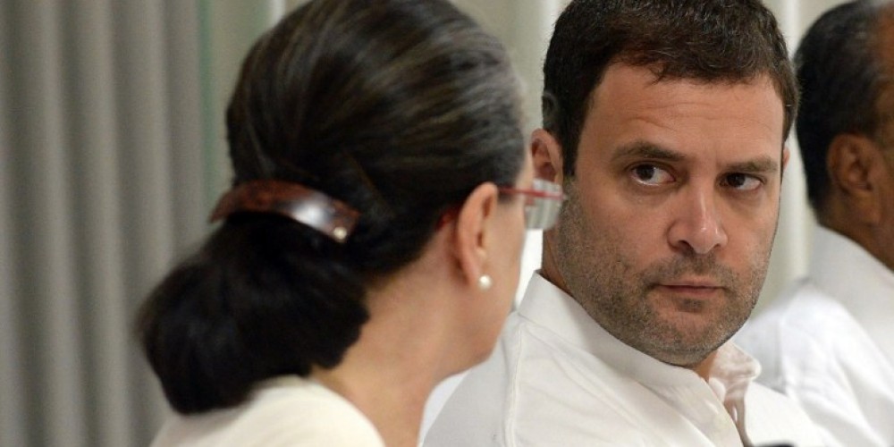 India Congress Party President Sonia Gandhi talks with Vice President Rahul Gandhi during a Congress Working Committee meeting in New Delhi